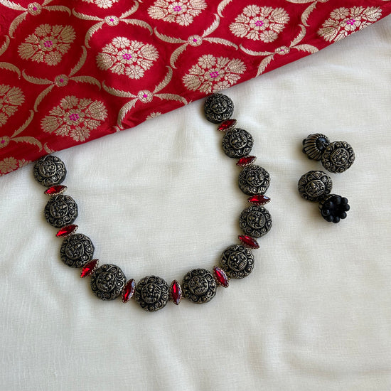 Oxidized silver Lakshmi terracotta necklace with red stones and jhumka earrings