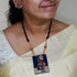 Brown owl terracotta pendant with tribal feather drops on black cord