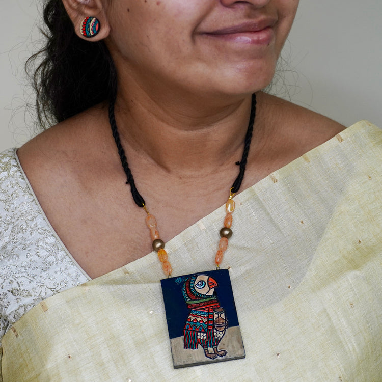 Brown owl terracotta pendant with tribal feather drops on black cord