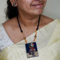 Brown owl terracotta pendant with tribal feather drops on black cord