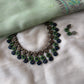 Handmade green and navy blue terracotta necklace set with leaf, floral, and geometric motifs.