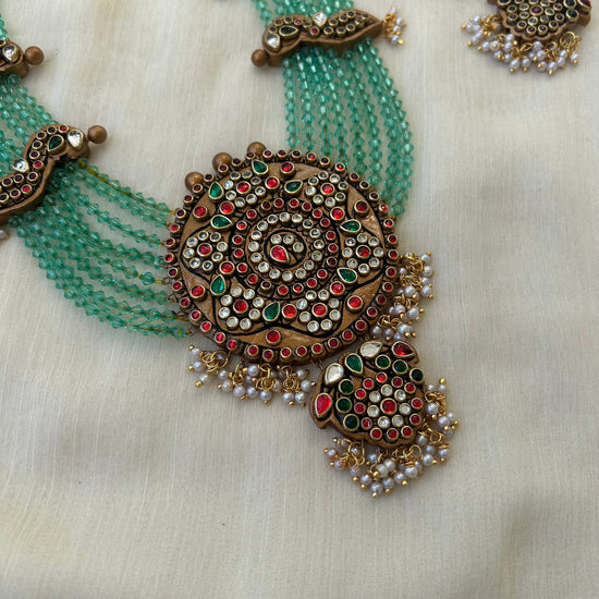 Crystal Layered Terracotta Peacock Necklace Set with Kundhan Stones