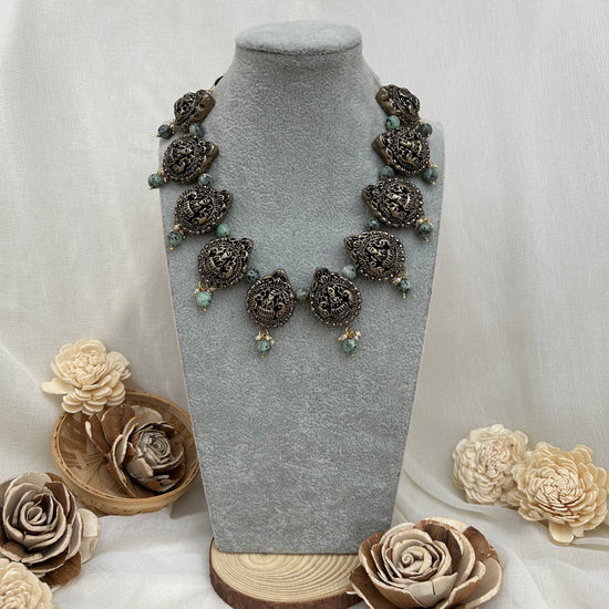 Oxidized silver Lakshmi mango terracotta necklace with blue speckled beads and jhumka earrings