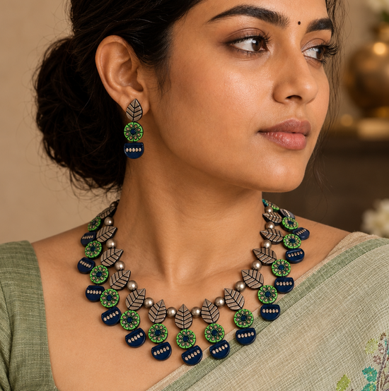 Handmade green and navy blue terracotta necklace set with leaf, floral, and geometric motifs.