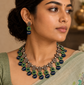 Handmade green and navy blue terracotta necklace set with leaf, floral, and geometric motifs.