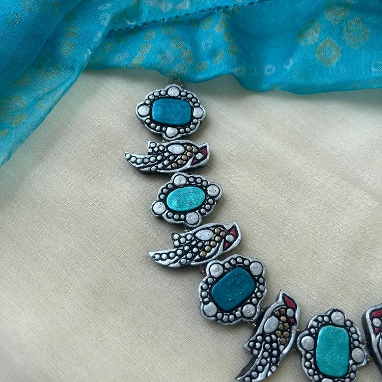 Teal clay bird necklace with matching earrings