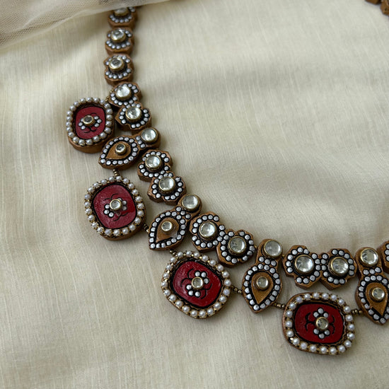 Gold and red kundan stone terracotta jewellery