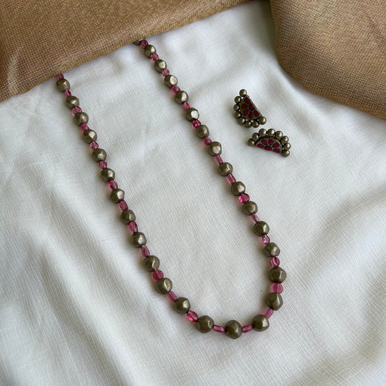 Antique gold and pink single strand beaded necklace set with crescent chandbali earrings