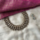 Handmade terracotta necklace set with white Kundan stone embellishments and antique-finish bead detailing.
