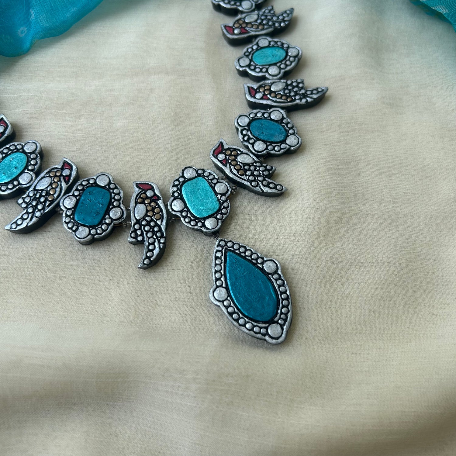 Statement teal terracotta bird necklace set