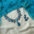 Handmade teal terracotta necklace with bird motif and stud earrings