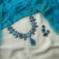Handmade teal terracotta necklace with bird motif and stud earrings