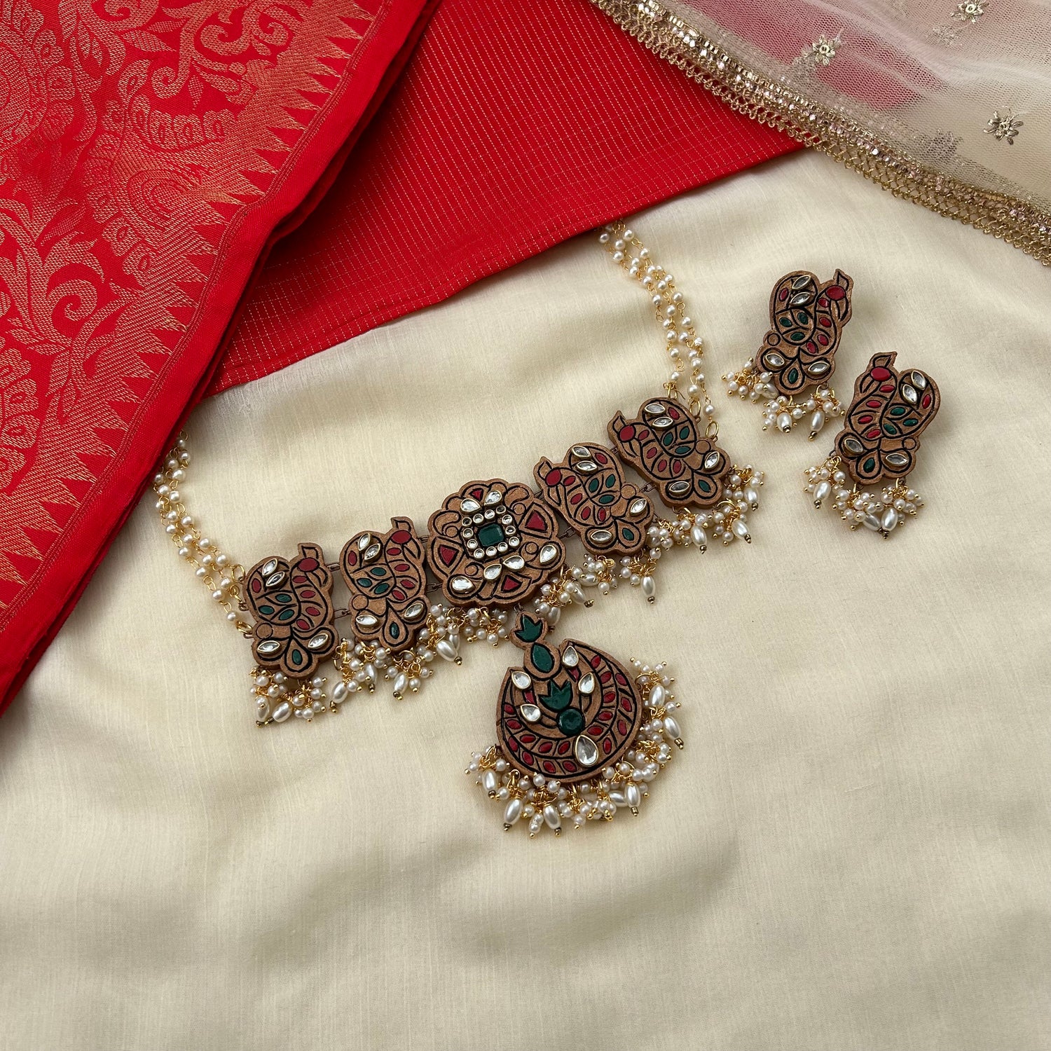 Grand peacock motif terracotta choker set with Kundan stones