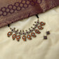 Paisley choker set with orange kundan stone