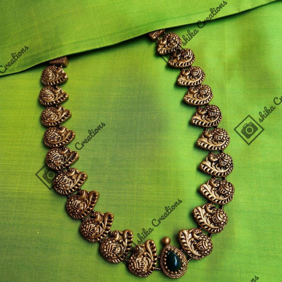 Antique gold handmade terracotta peacock haram with jhumka