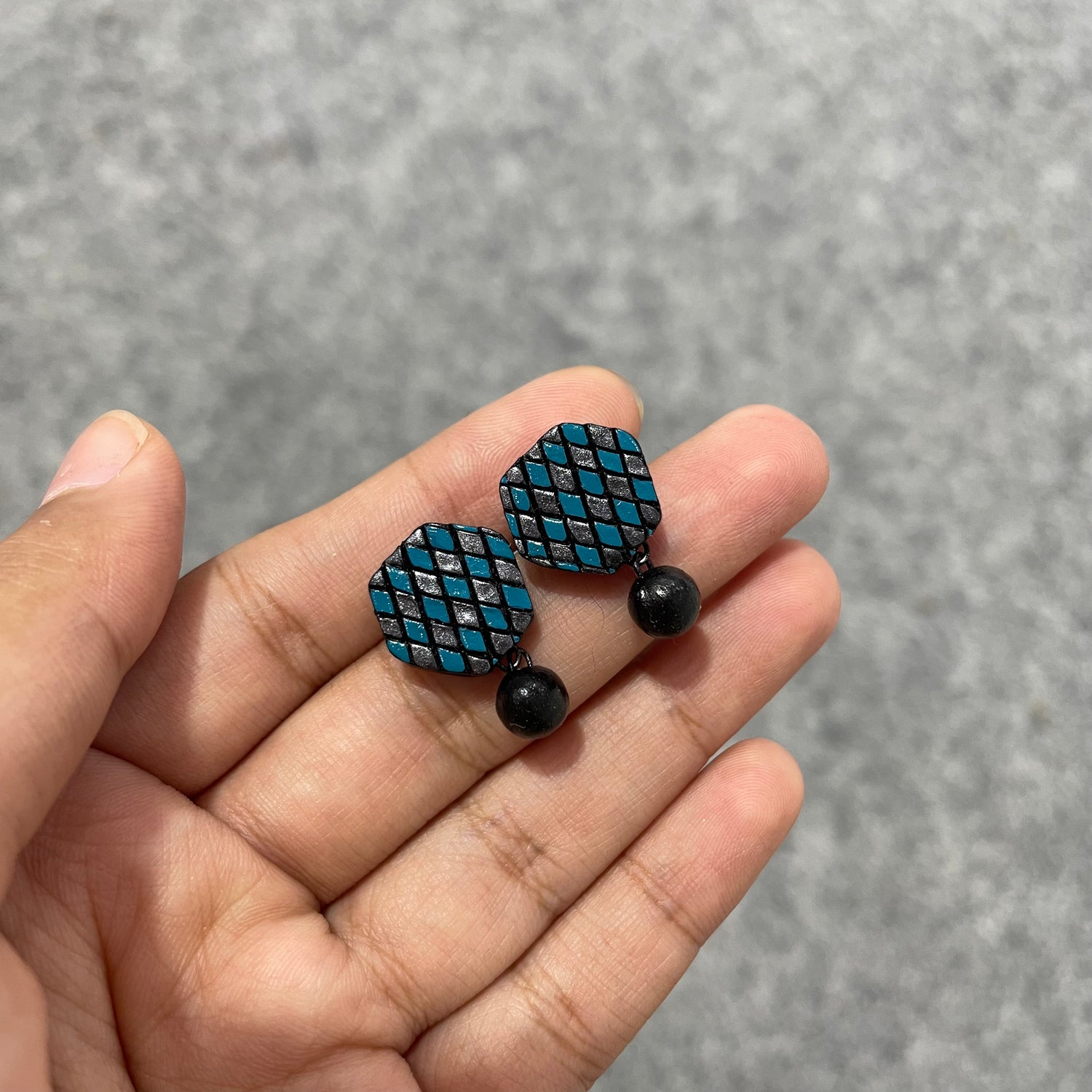 Handmade blue and silver dazzling clay stud earrings with clay bead drop.