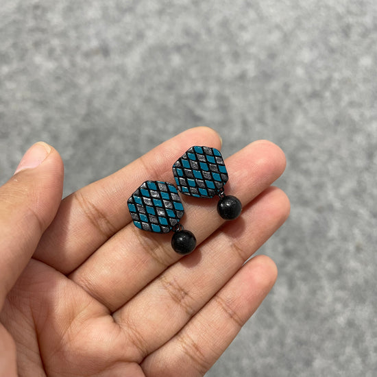 Handmade blue and silver dazzling clay stud earrings with clay bead drop.