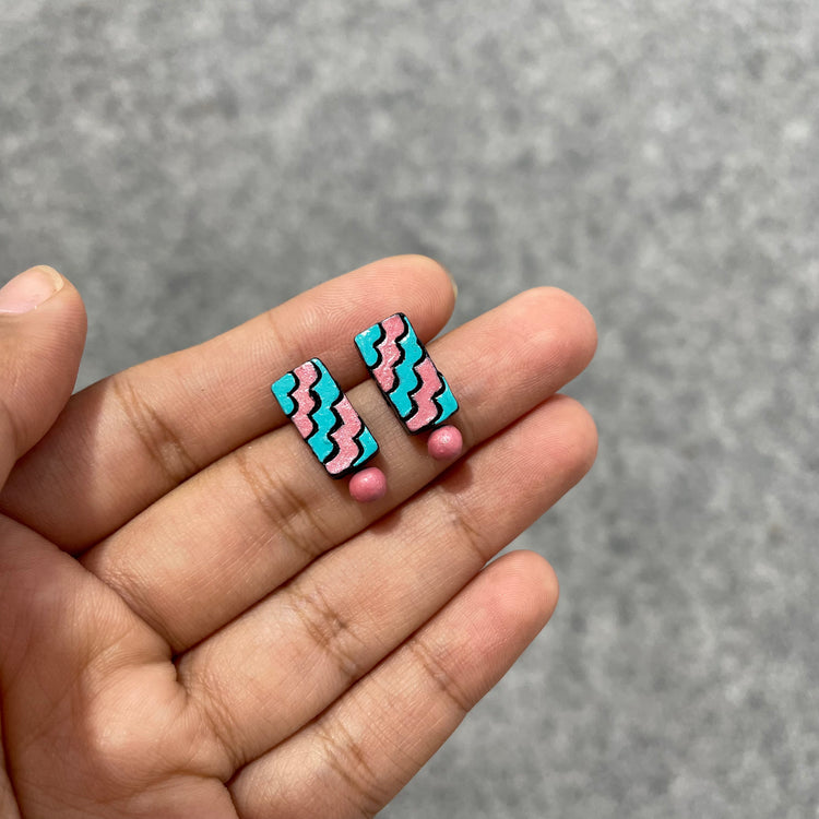 Handmade pastel pink and blue clay stud earrings with clay bead drop.