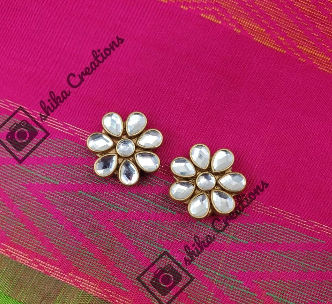 Handmade terracotta clay white kundhan flower stud earrings.
