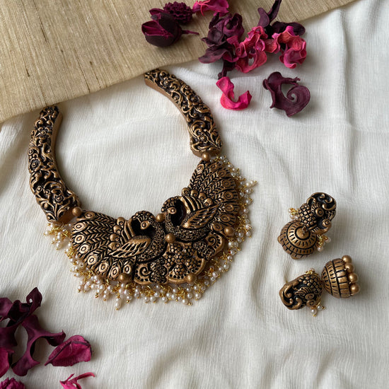 Peacock wrapped in gold
