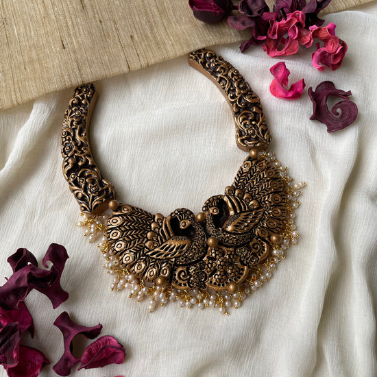 Peacock wrapped in gold