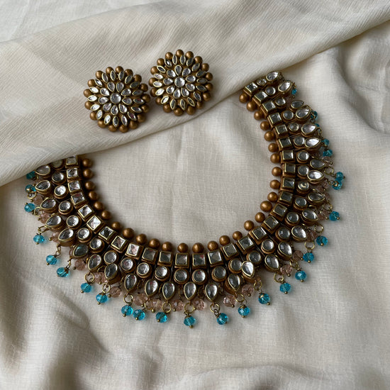 White kundhans with pastel danglers