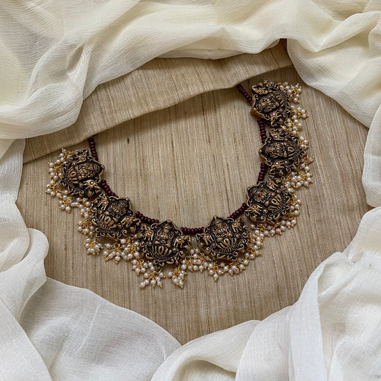 Lakshmi with dangling pearls